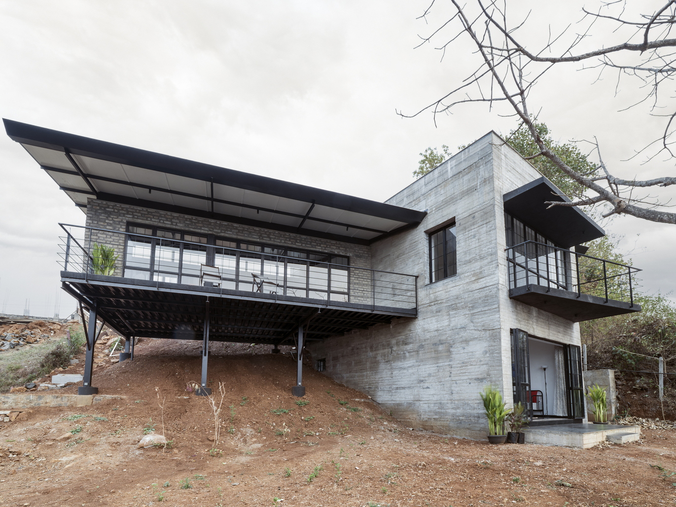 sloped to fit 14 homes that embrace the hill as a catalyst for their design - 25036